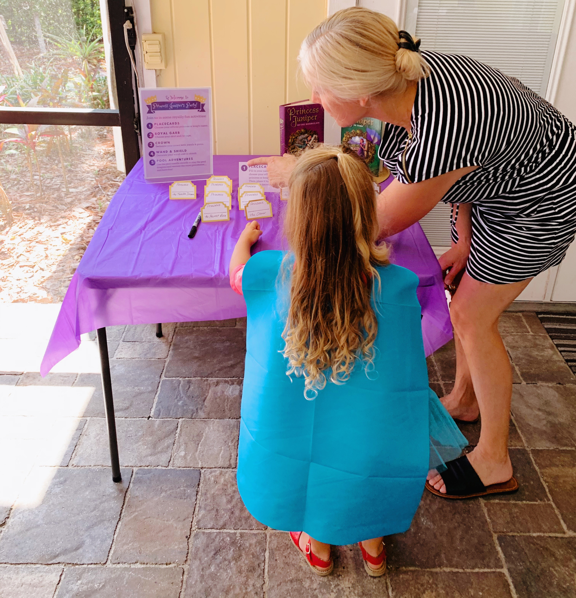 Juniper's "Princesses & Knights" 5th Birthday Pool Party & Royal Golden Birthday Celebration | Creative ideas including a punny invitation, DIY castle backdrop, a golden birthday banner, creative activities for kids of all ages & party favors galore! via thinkingcloset.com