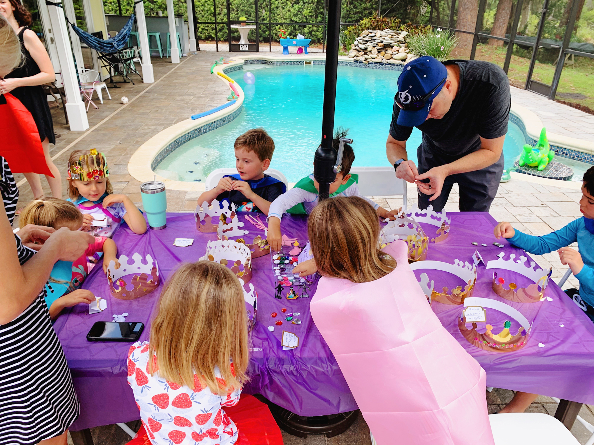Juniper's "Princesses & Knights" 5th Birthday Pool Party & Royal Golden Birthday Celebration | Creative ideas including a punny invitation, DIY castle backdrop, a golden birthday banner, creative activities for kids of all ages & party favors galore! via thinkingcloset.com