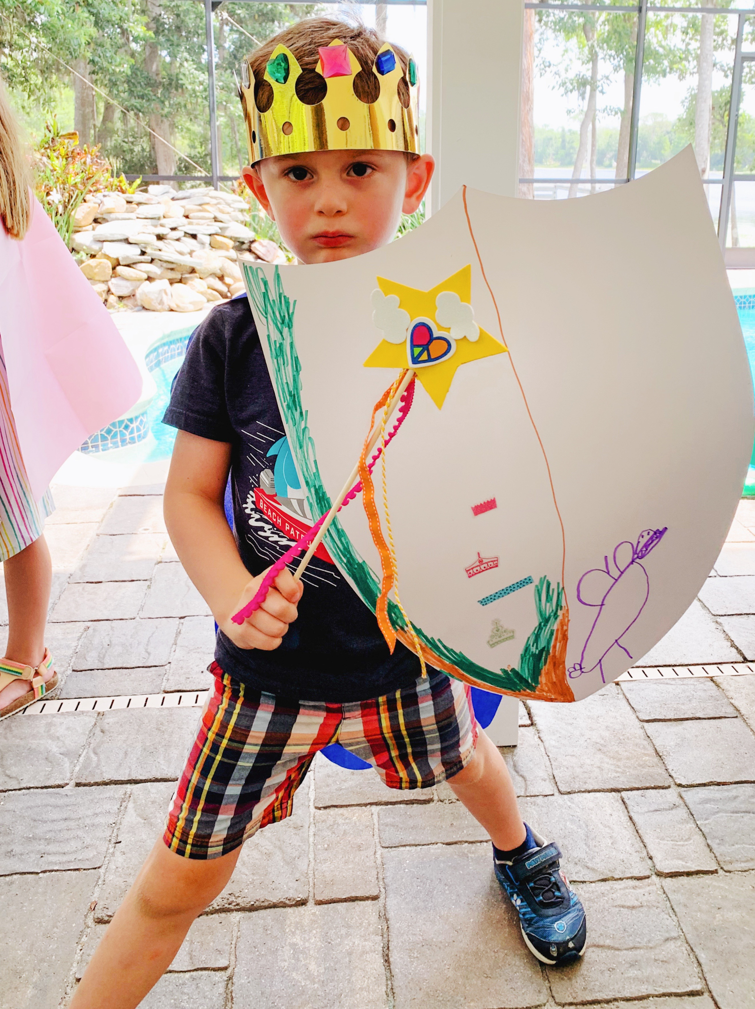 Juniper's "Princesses & Knights" 5th Birthday Pool Party & Royal Golden Birthday Celebration | Creative ideas including a punny invitation, DIY castle backdrop, a golden birthday banner, creative activities for kids of all ages & party favors galore! via thinkingcloset.com