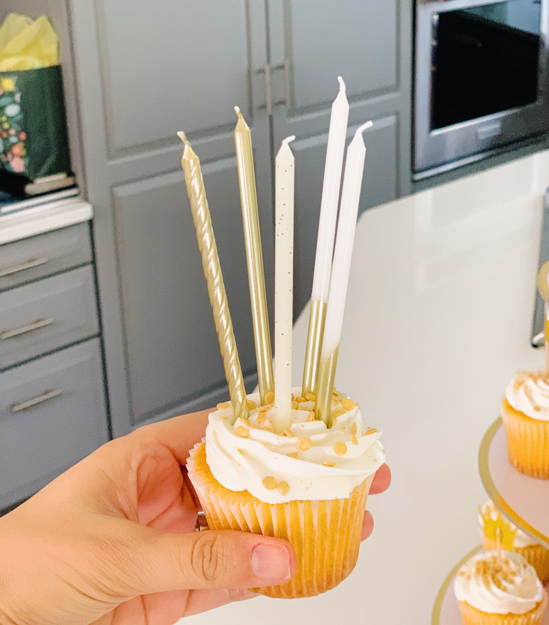 Cupcakes fit for a queen at Juniper's "Princesses & Knights" 5th Birthday Pool Party & Royal Golden Birthday Celebration | Creative ideas including a punny invitation, DIY castle backdrop, a golden birthday banner, creative activities for kids of all ages & party favors galore! via thinkingcloset.com