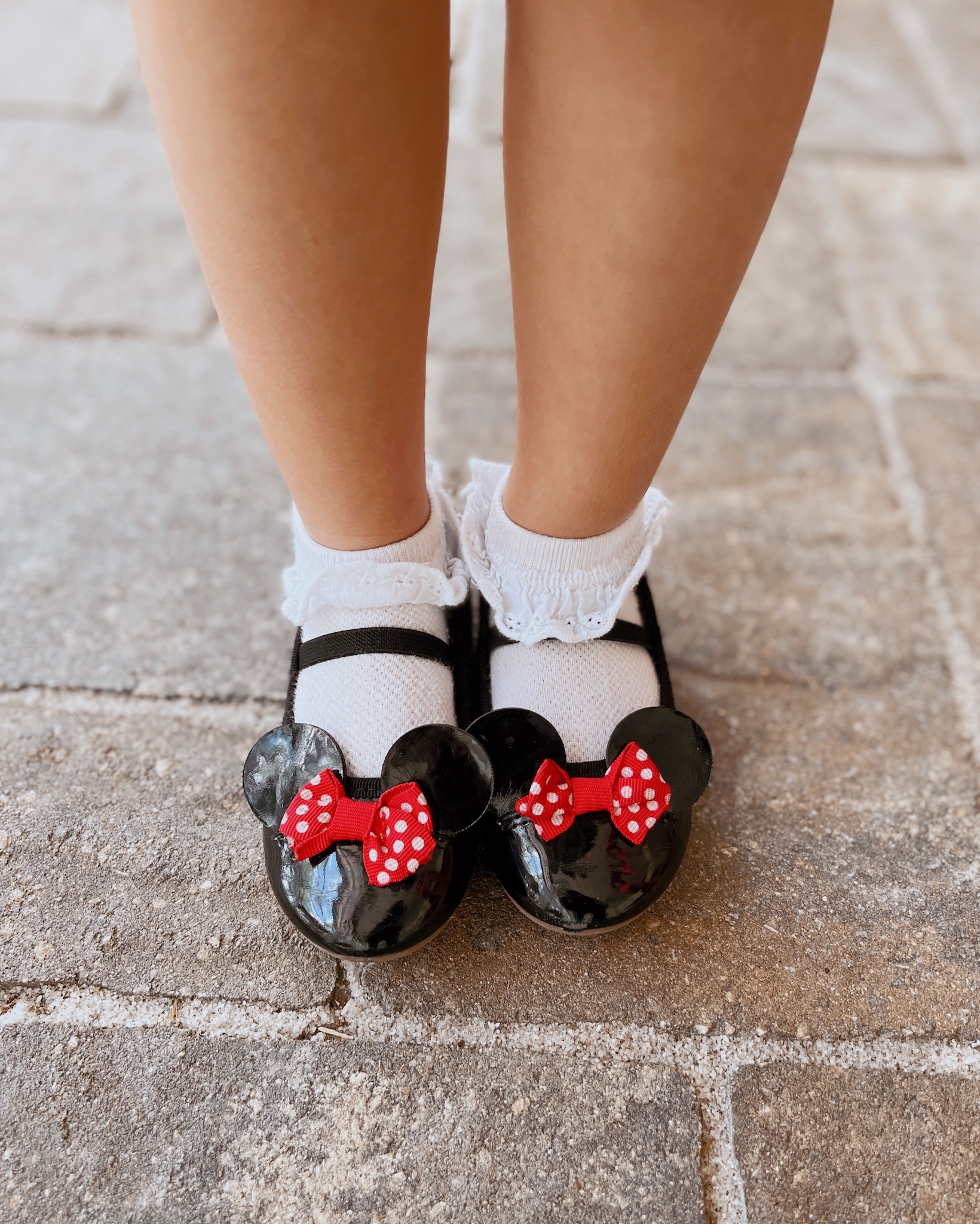 Thrifted Minnie Mouse shoes for Pepper's Magical "Mickey & Minnie Mouse" 3rd Birthday Pool Party | Creative ideas for hosting a magical Mickey & Minnie themed birthday bash for your little Mouseketeer with do-able decor, punny snacks, and party games that are fun for all ages! via thinkingcloset.com