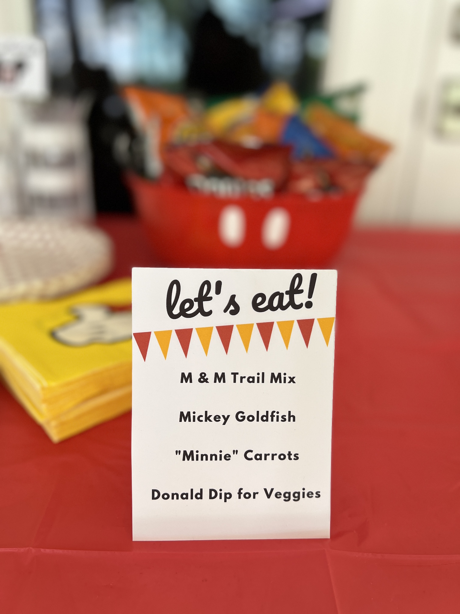 Themed snack foods at Pepper's Magical "Mickey & Minnie Mouse" 3rd Birthday Pool Party | Creative ideas for hosting a magical Mickey & Minnie themed birthday bash for your little Mouseketeer with do-able decor, punny snacks, and party games that are fun for all ages! via thinkingcloset.com