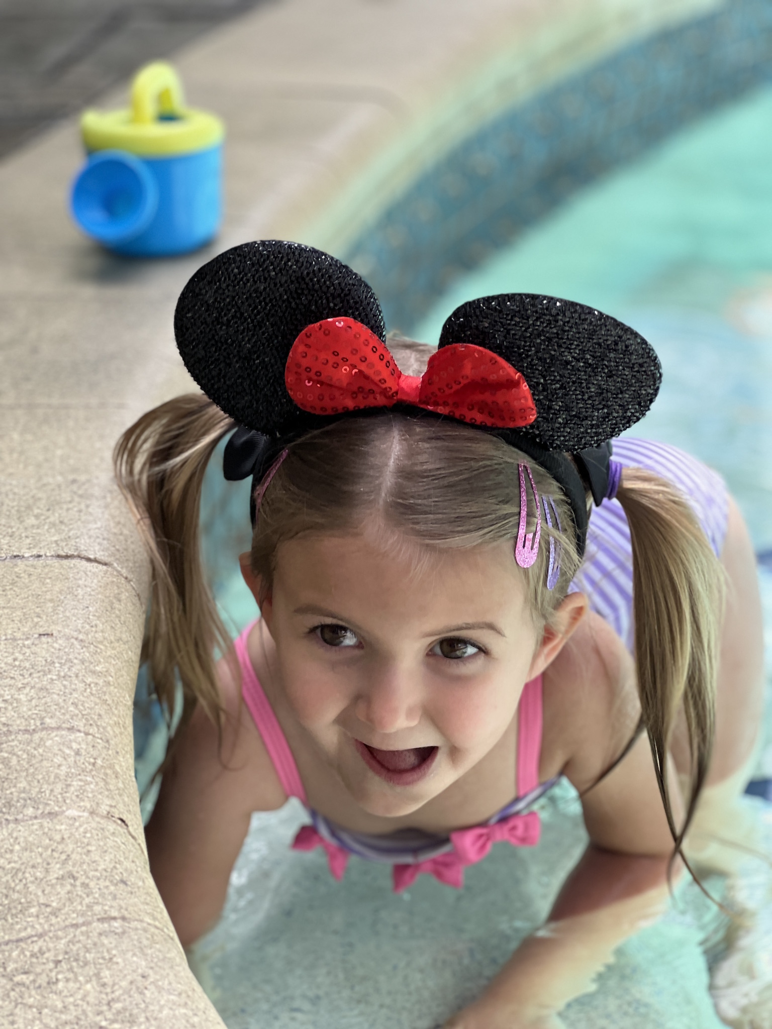 Pool time fun at Pepper's Magical "Mickey & Minnie Mouse" 3rd Birthday Pool Party | Creative ideas for hosting a magical Mickey & Minnie themed birthday bash for your little Mouseketeer with do-able decor, punny snacks, and party games that are fun for all ages! via thinkingcloset.com
