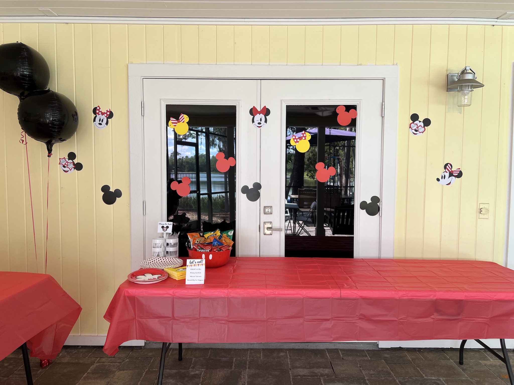 Simple wall party decor at Pepper's Magical "Mickey & Minnie Mouse" 3rd Birthday Pool Party | Creative ideas for hosting a magical Mickey & Minnie themed birthday bash for your little Mouseketeer with do-able decor, punny snacks, and party games that are fun for all ages! via thinkingcloset.com