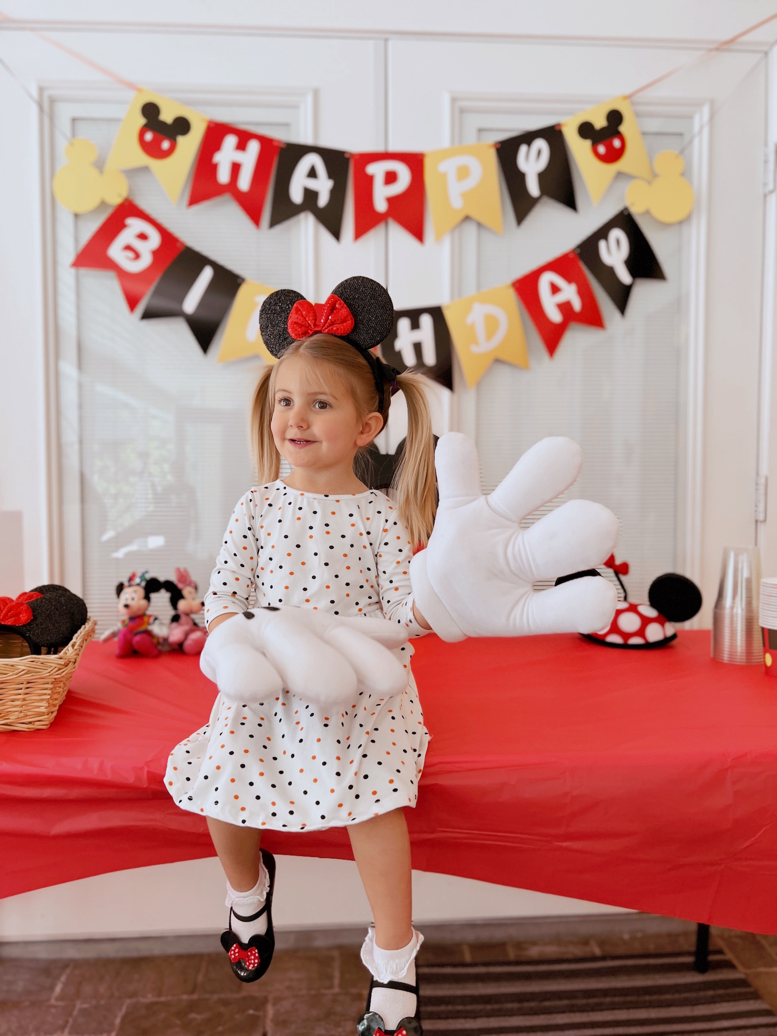 Bring on the Mickey hand props for Pepper's Magical "Mickey & Minnie Mouse" 3rd Birthday Pool Party | Creative ideas for hosting a magical Mickey & Minnie themed birthday bash for your little Mouseketeer with do-able decor, punny snacks, and party games that are fun for all ages! via thinkingcloset.com