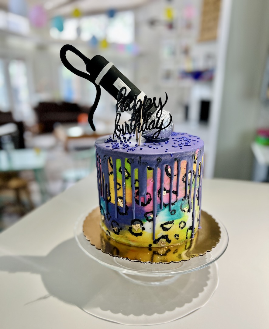 Lisa Frank style cake from Lauren's 1980s Themed 40th Birthday Karaoke Party | Turns out that turning 40 can be totally tubular! Hop over to ThinkingCloset.com for all the awesome birthday party details.