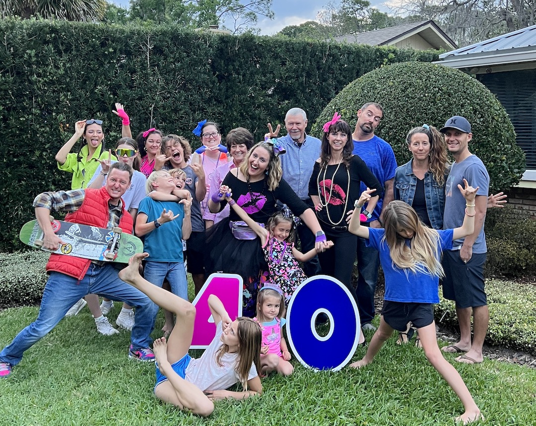 The whole fantastic crew at Lauren's 1980s Themed 40th Birthday Karaoke Party | Turns out that turning 40 can be totally tubular! Hop over to ThinkingCloset.com for the 411 on this bodacious birthday bash to remember!
